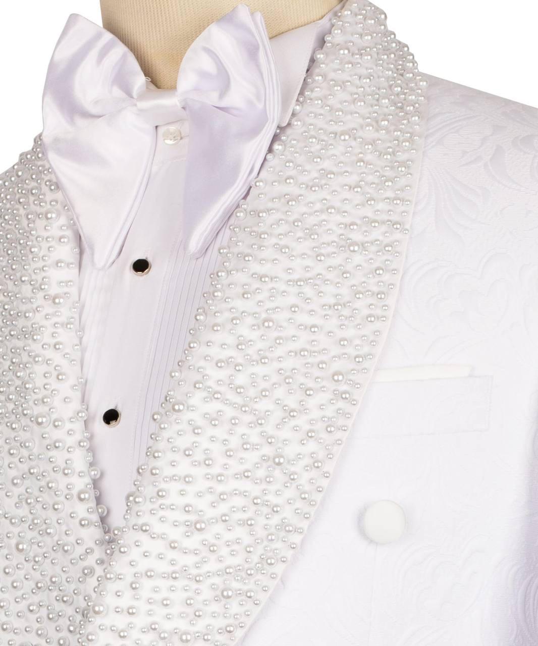White formal tuxedo jacket with a heavily beaded pearl collar, matching white satin bow tie, and white pleated shirt on a mannequin torso.
