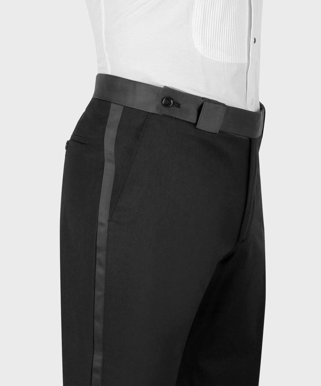 Black dress pants with a gray belt and white shirt on a light gray background