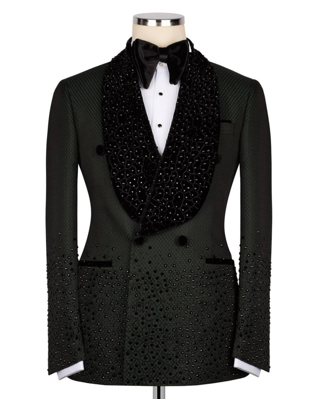 A black double-breasted tuxedo jacket with a heavily embellished beaded and sequined shawl collar, displayed on a mannequin with a white dress shirt and black bow tie against a plain white background.