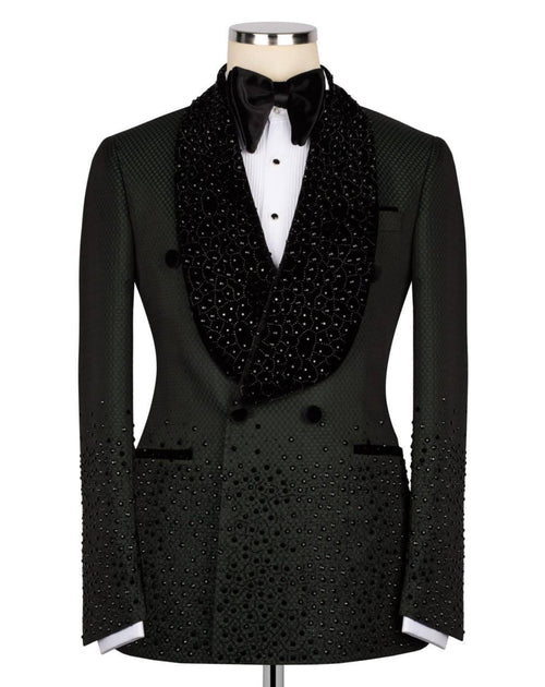 A black double-breasted tuxedo jacket with a heavily embellished beaded and sequined shawl collar, displayed on a mannequin with a white dress shirt and black bow tie against a plain white background.