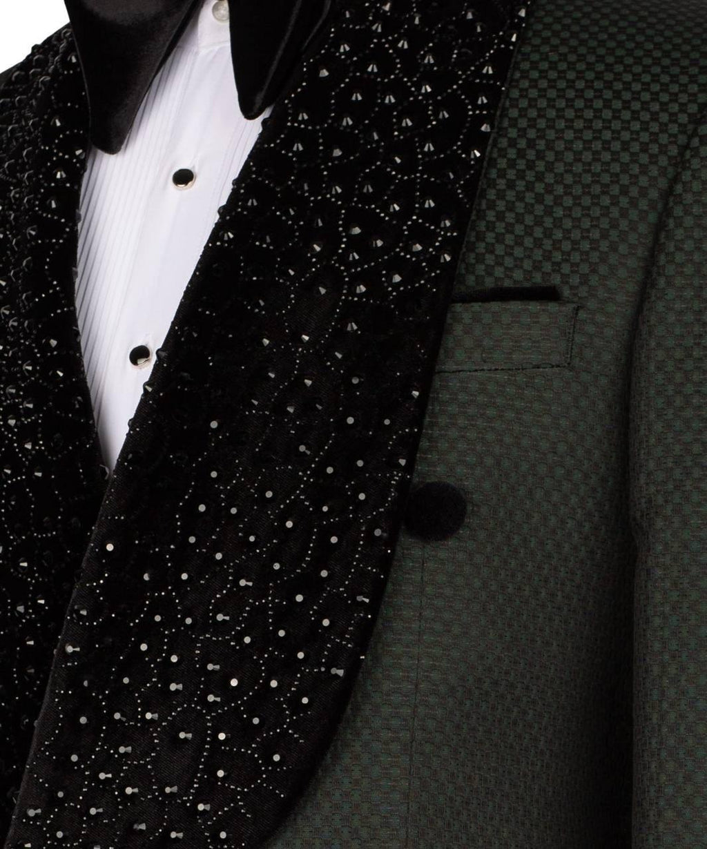 Close-up of a black tuxedo with a patterned lapel and white shirt.