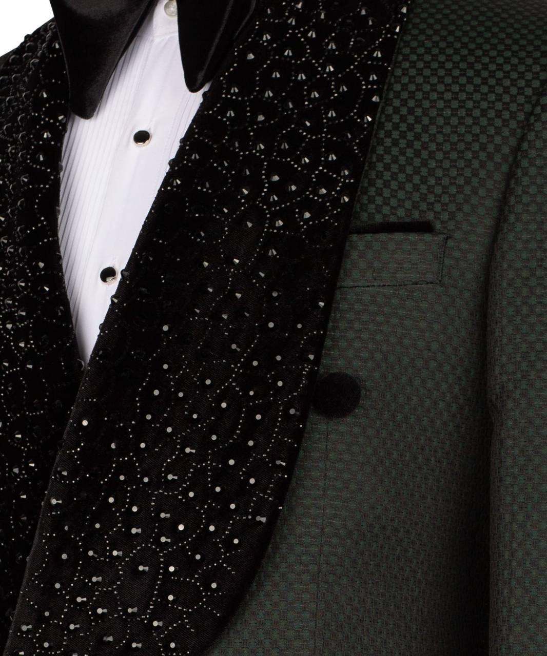 Close-up of a black tuxedo with a patterned lapel and white shirt.