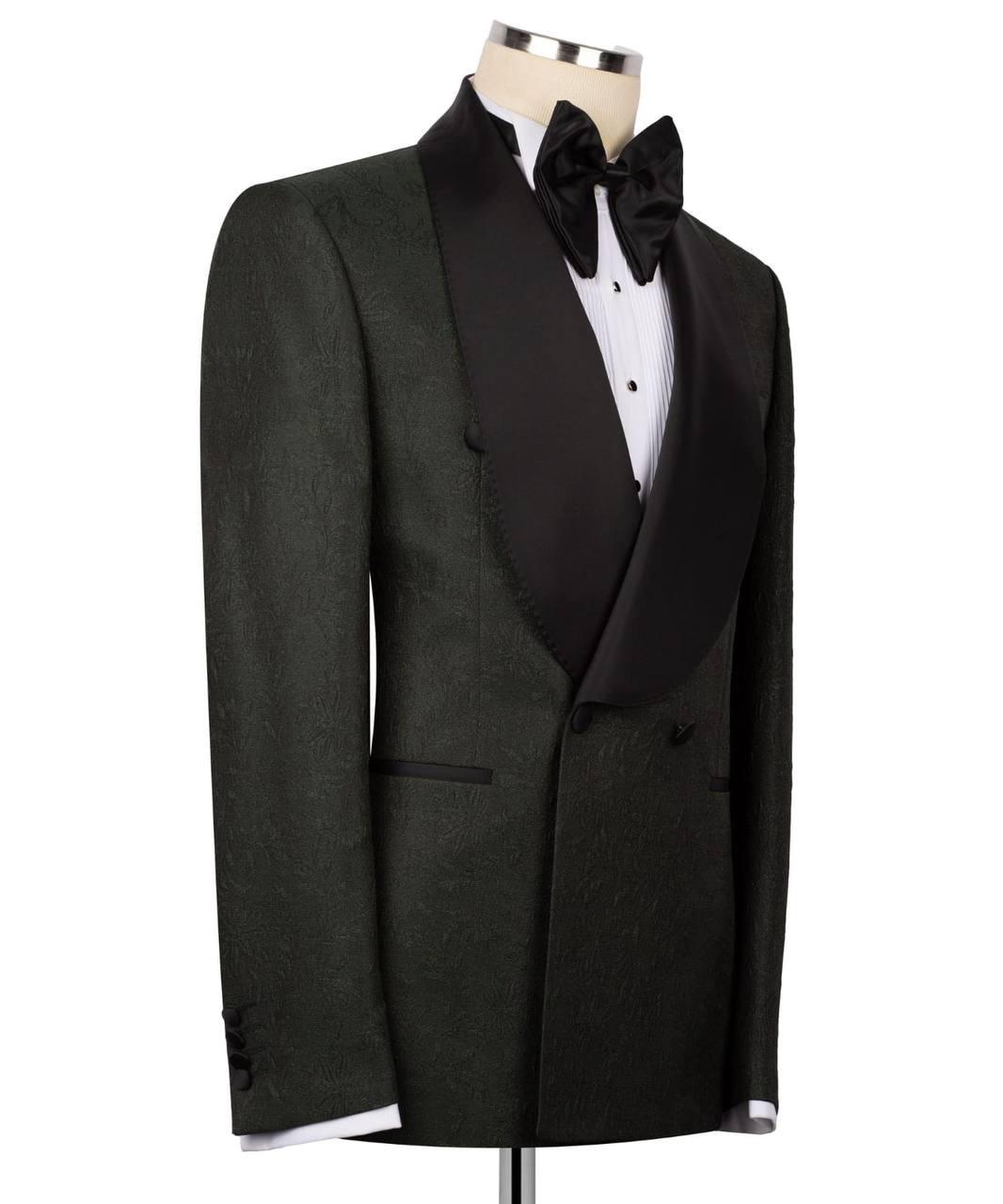 Black tuxedo jacket with matching bow tie on a mannequin against a white background