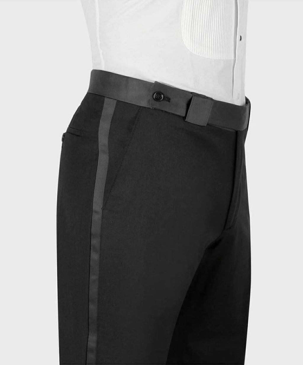 Black dress pants with a gray belt and white shirt on a light gray background