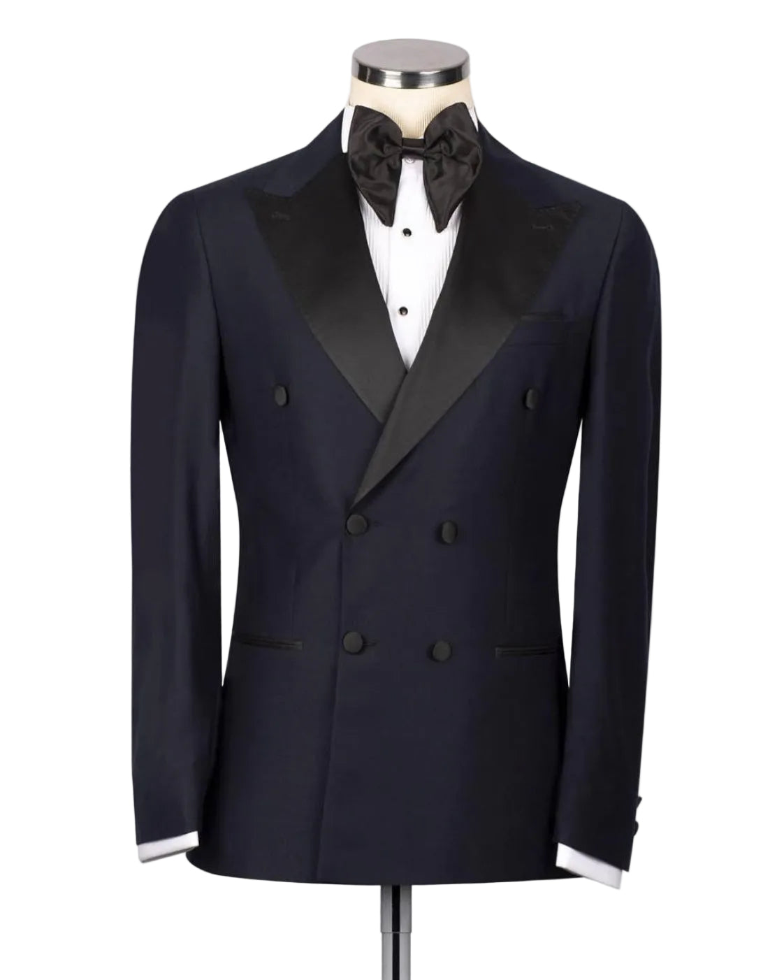 A navy blue double-breasted tuxedo jacket with black satin peak lapels, displayed on a mannequin torso with a black bow tie, white dress shirt, and white cufflinks against a light gray background.