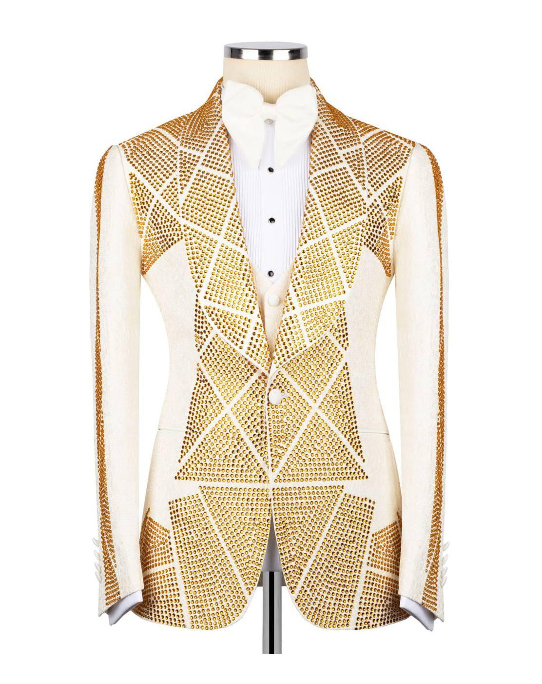 A white and gold embellished blazer jacket with a geometric rhinestone pattern, displayed on a mannequin torso with a white shirt underneath.