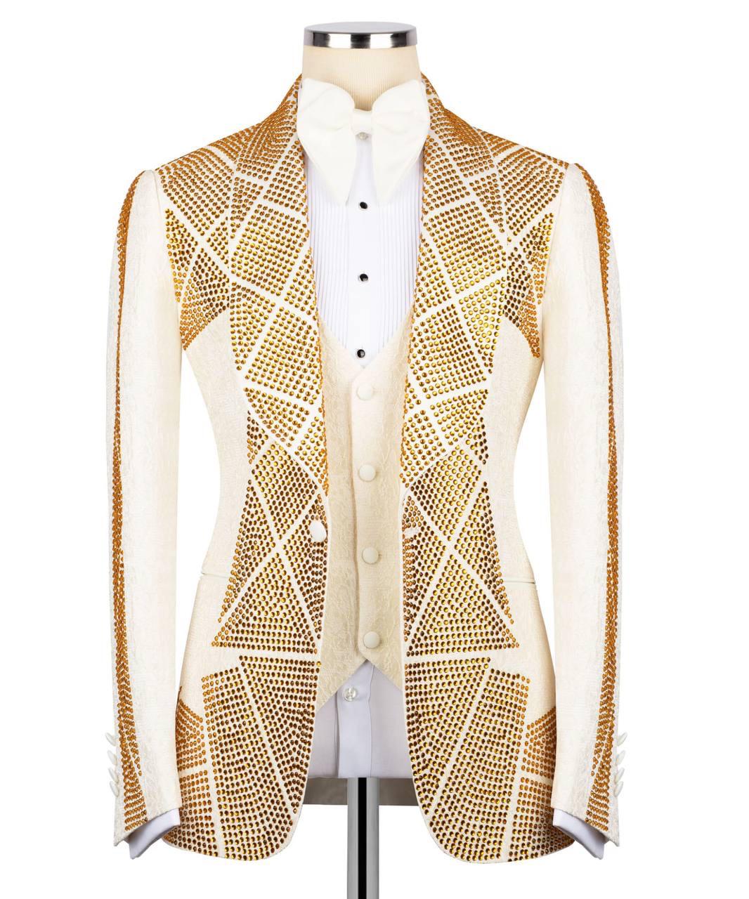 A white and gold embellished formal jacket with geometric rhinestone patterns, displayed on a mannequin torso over a white shirt against a plain white background.