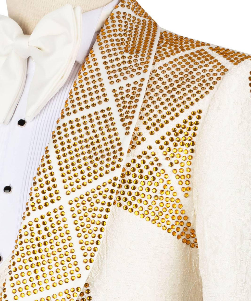 White cardigan with gold studded pattern on a white background
