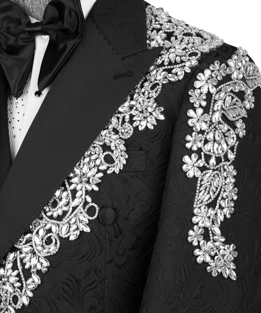 Black tuxedo with white floral embroidery on a white background