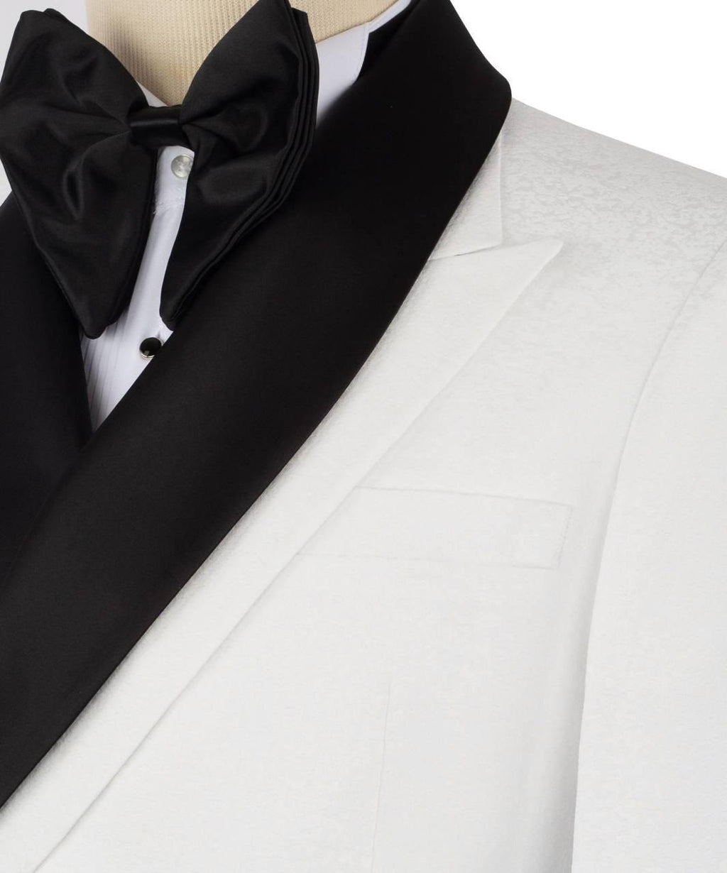White tuxedo with black bow tie and cravat on a mannequin against a white background