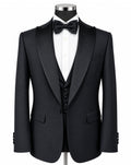 A black tuxedo jacket displayed on a mannequin torso with a white dress shirt, black bow tie, black vest, and a silver stand against a plain white background.