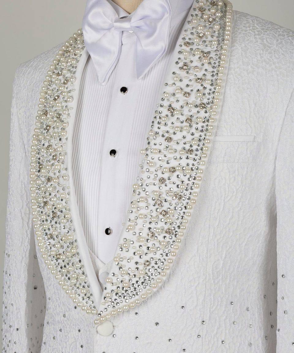 White formal tuxedo jacket with a white satin bow tie and white pleated shirt, heavily embellished with white pearls and silver rhinestones along the lapels.