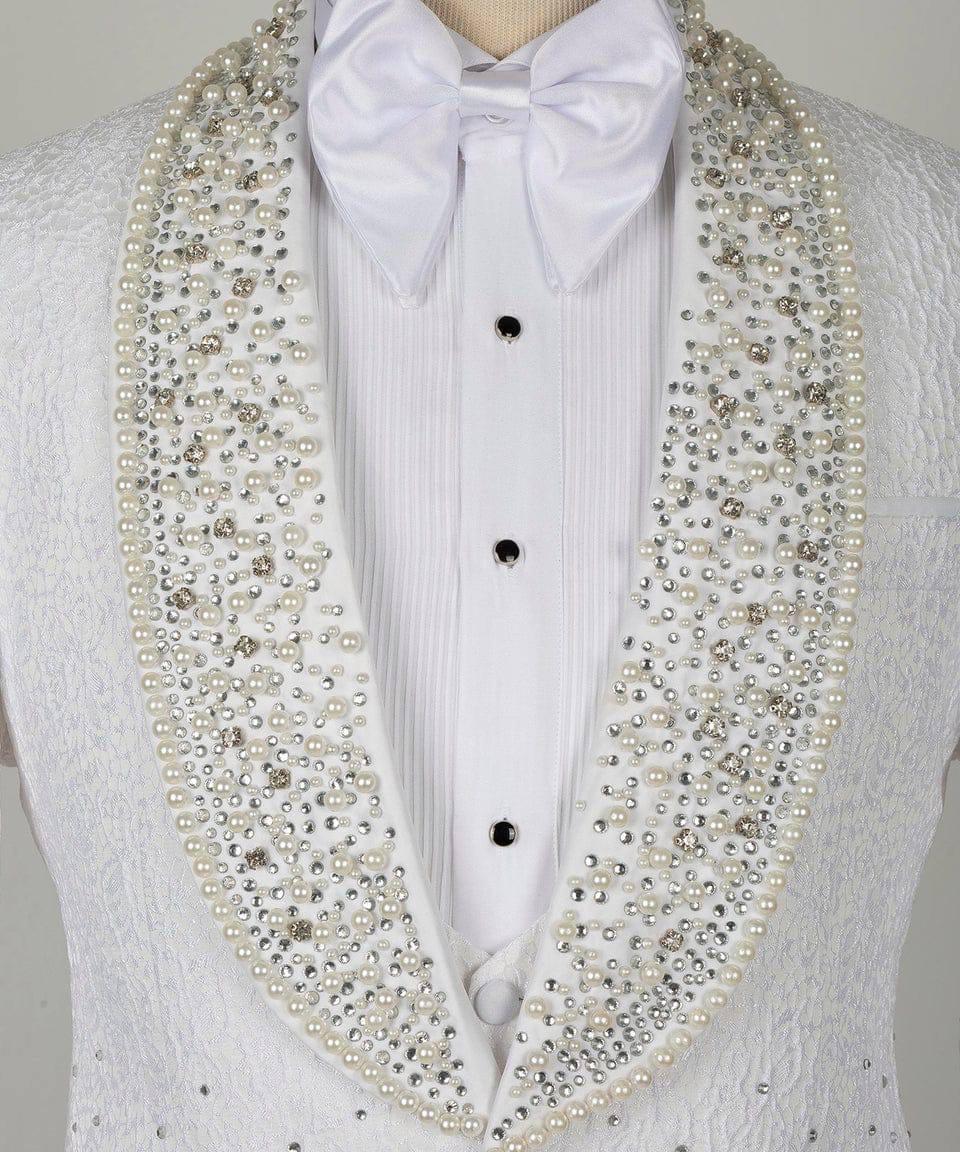 A white tuxedo jacket with a matching white bow tie, featuring a large, ornate collar embellished with white faux pearls and silver rhinestones.