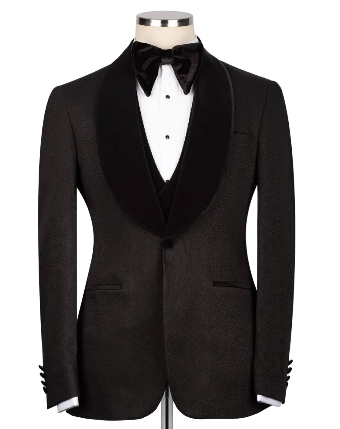 A black tuxedo jacket with a satin peak lapel, displayed on a mannequin torso with a white dress shirt, black bow tie, and matching vest against a light gray background.