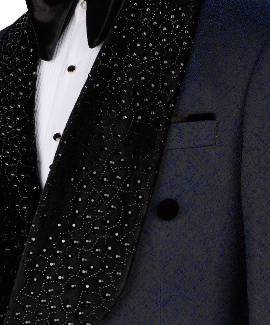 Close-up of a black tuxedo with white polka dot lapel and white shirt.