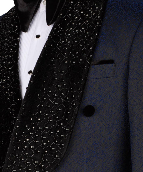 Close-up of a black tuxedo with white polka dot lapel and white shirt.