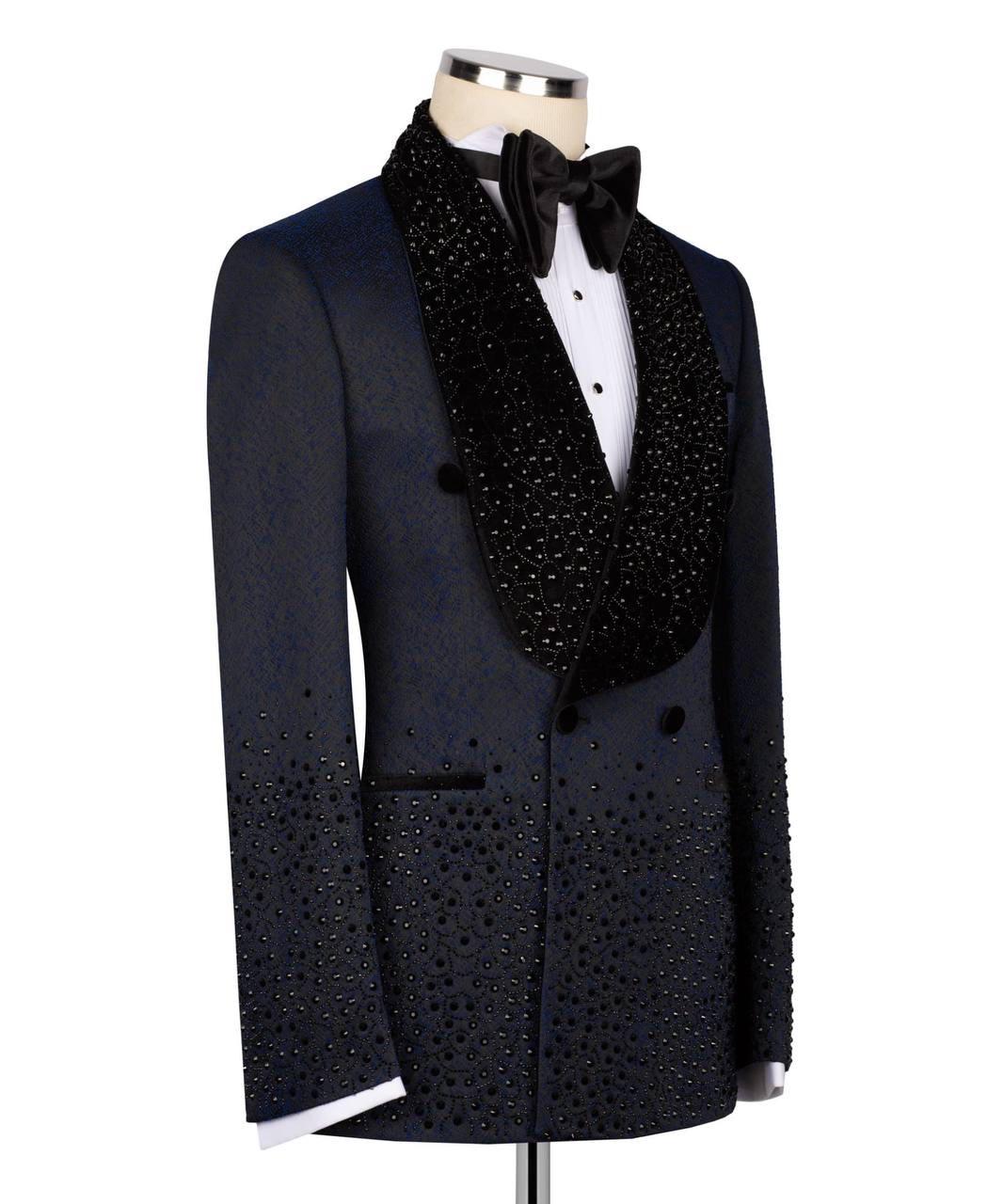 Black tuxedo with bow tie on a mannequin against a white background