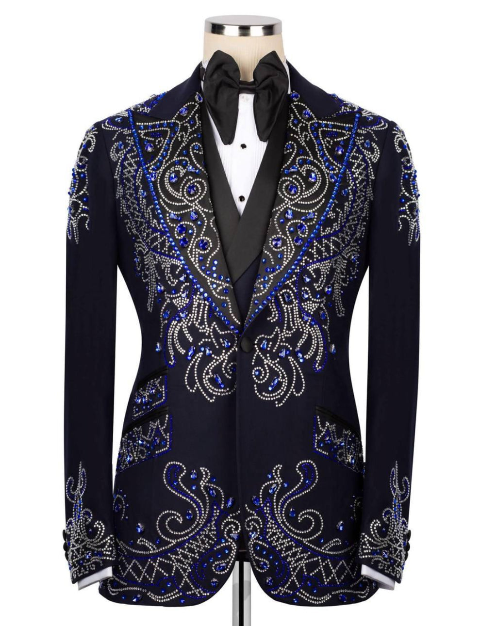 Black tuxedo with blue and silver embroidery on a mannequin against a white background