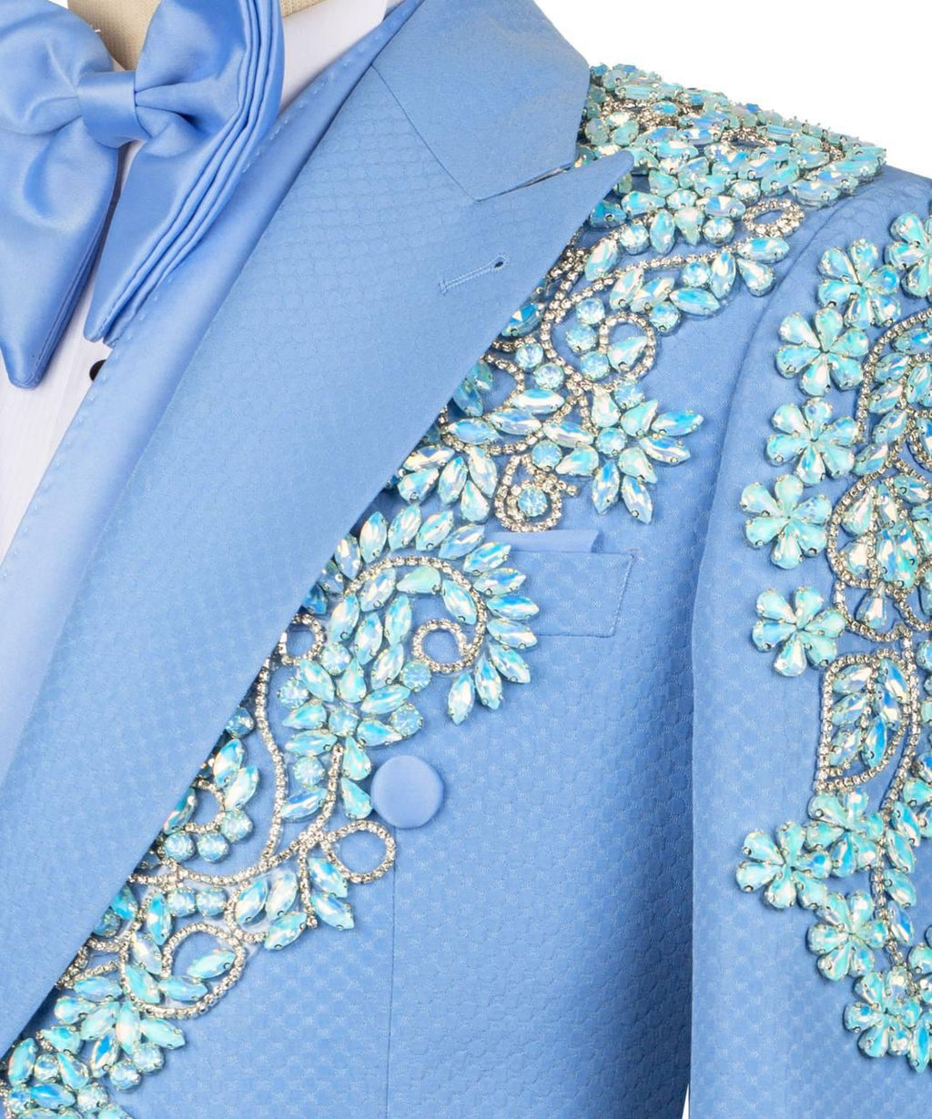 Blue tuxedo with intricate beadwork on a white background