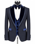 A navy blue formal tuxedo jacket with dark blue velvet shawl lapels, a matching navy velvet vest, a navy bow tie, and a white dress shirt, displayed on a mannequin torso against a white background.