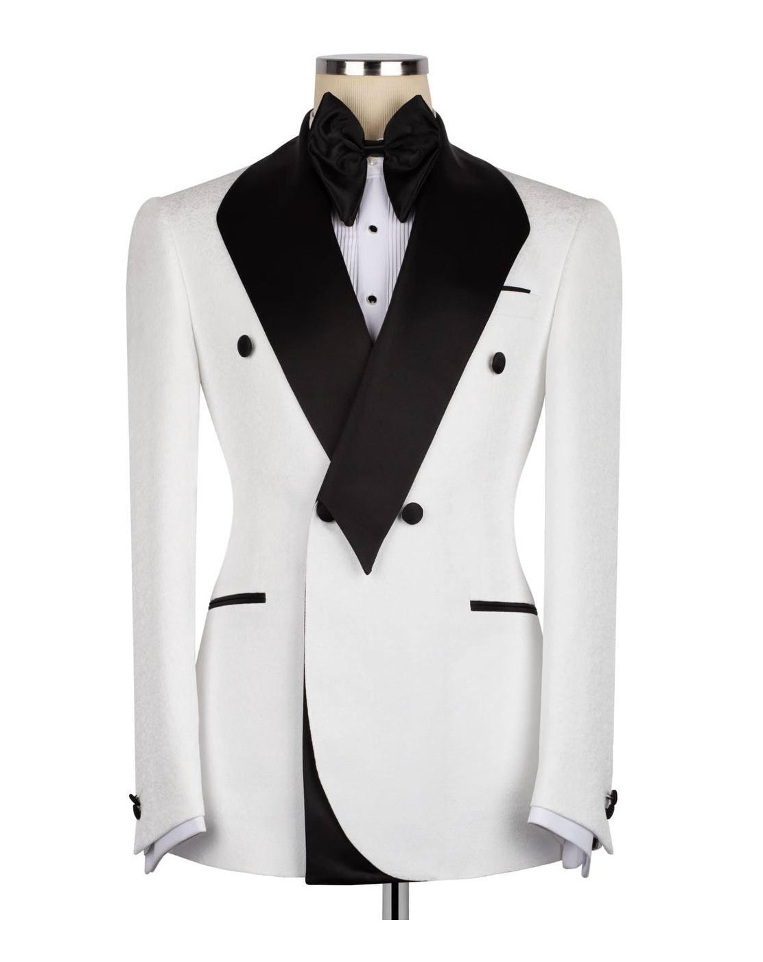 A white double-breasted tuxedo jacket with black satin peak lapels, displayed on a mannequin torso with a black bow tie and white shirt.