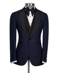 Black tuxedo jacket on a mannequin with a white shirt and black bow tie against a light gray background