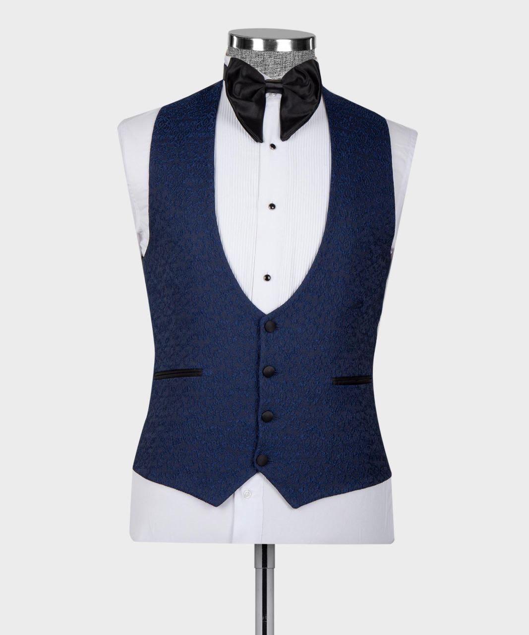A navy blue textured waistcoat displayed on a white dress shirt mannequin torso, styled with a black bow tie and a silver patterned neckband against a light gray background.