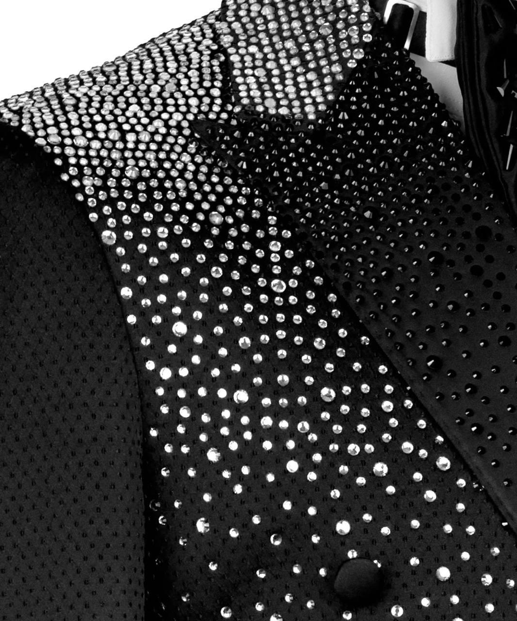 Black blazer with silver studs on a mannequin against a white background
