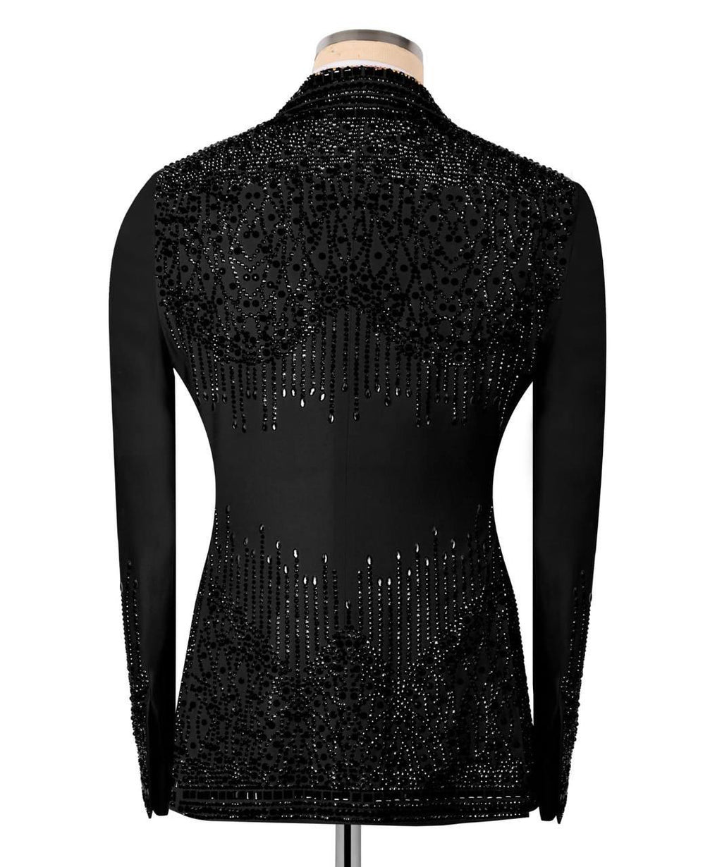 Black long-sleeve mock-neck jacket with intricate beaded sequin patterns on the back and sleeves, displayed on a mannequin against a white background.