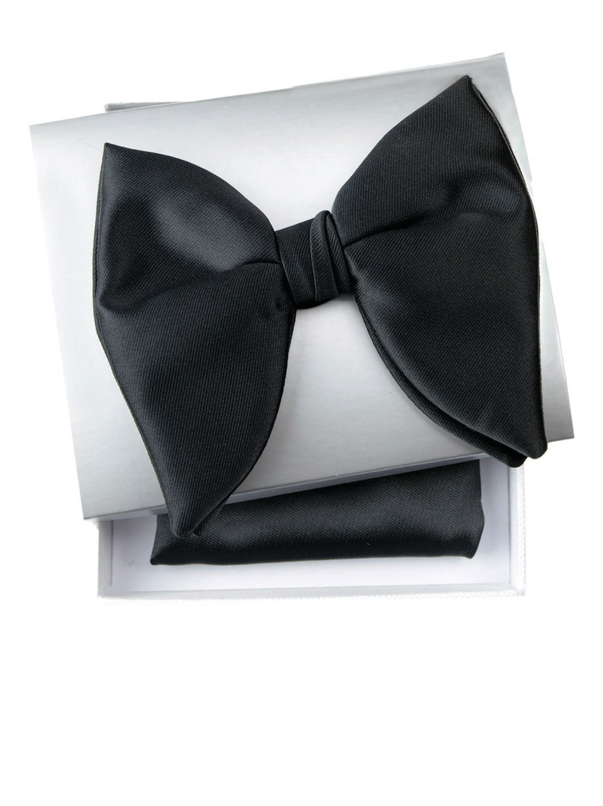 A pre-tied black satin bow tie presented on top of its white gift box, with a matching black pocket square folded underneath.