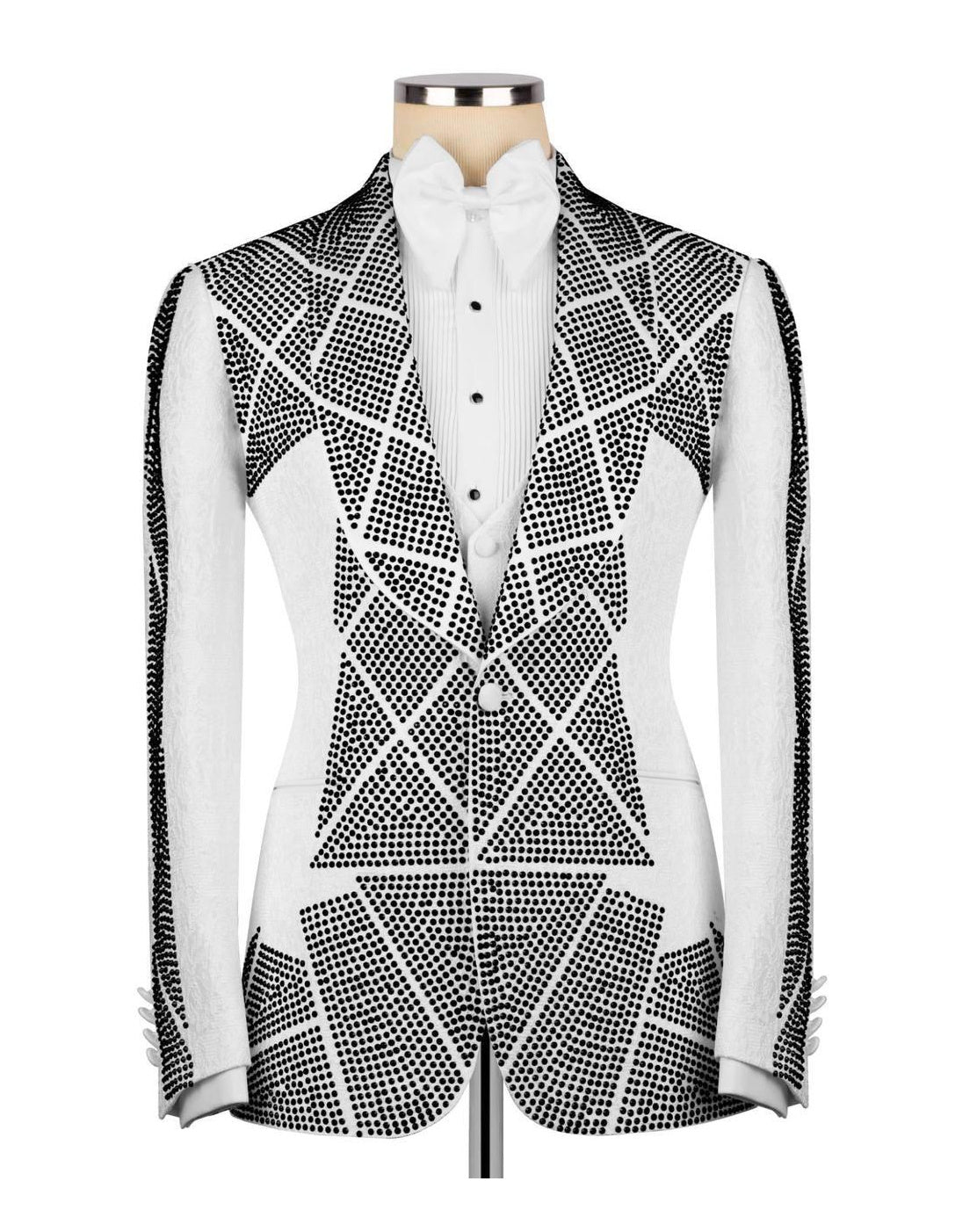 A men's tuxedo jacket with a white satin peak lapel and geometric black rhinestone pattern, styled on a mannequin with a white shirt and bow tie against a white background.