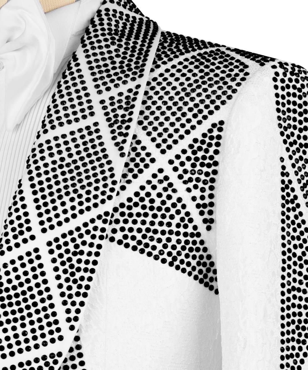 Close-up of a white garment with black dot pattern