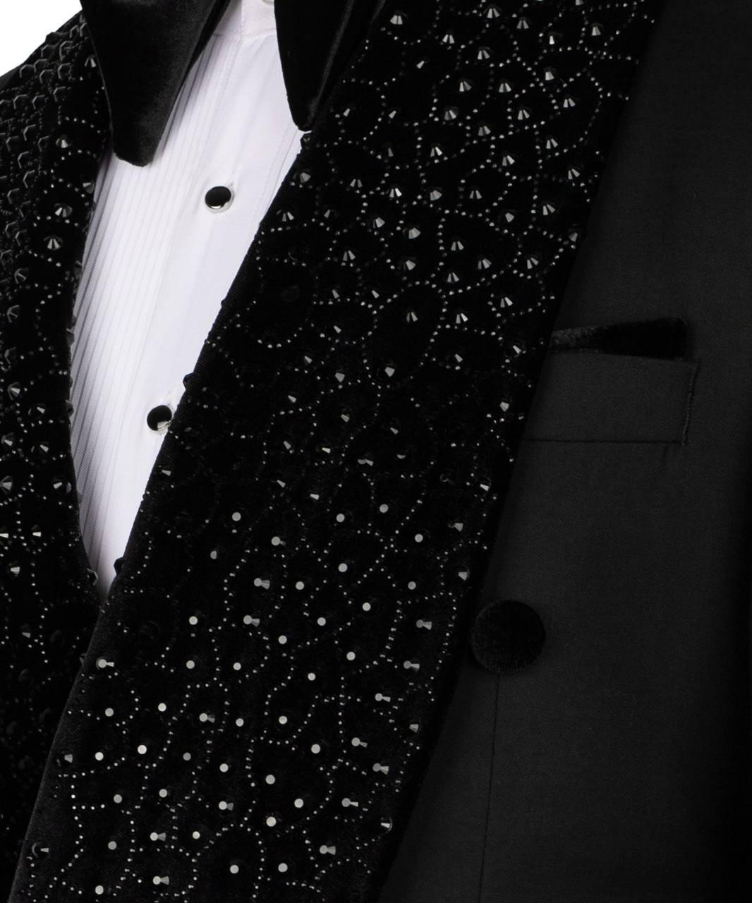 Black tuxedo with white dress shirt and black bow tie