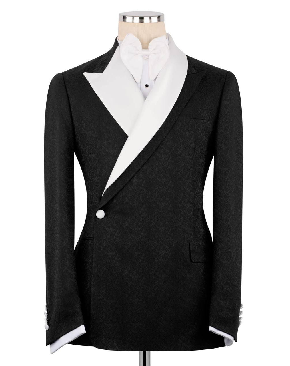 Black blazer with white shirt and bow tie on a mannequin against a white background