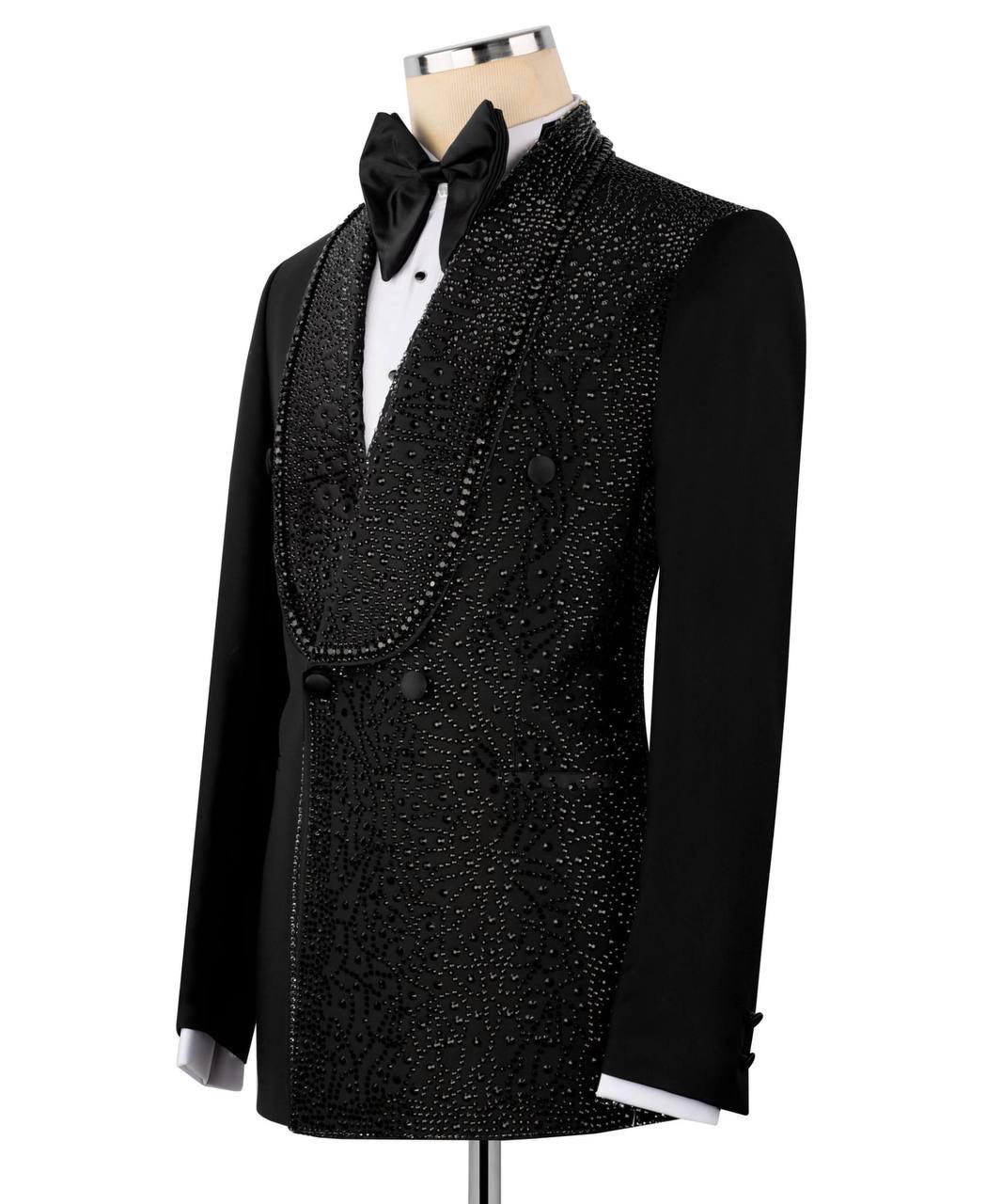 Black tuxedo with bow tie on a mannequin against a white background