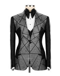 A men's tuxedo jacket with a black and white geometric rhinestone pattern, displayed on a mannequin with a black bow tie and white pleated shirt.