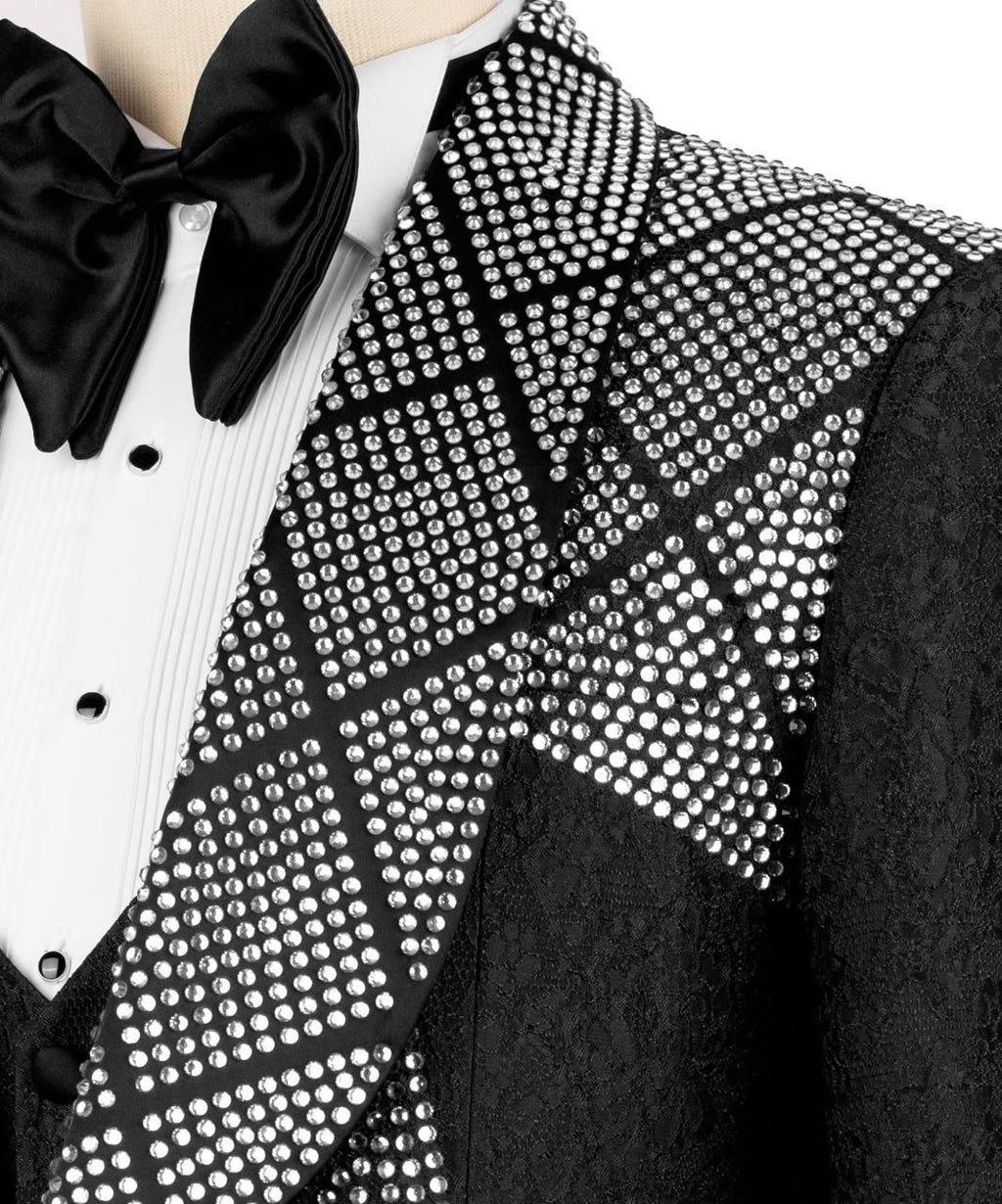Black tuxedo with a bow tie and studded vest
