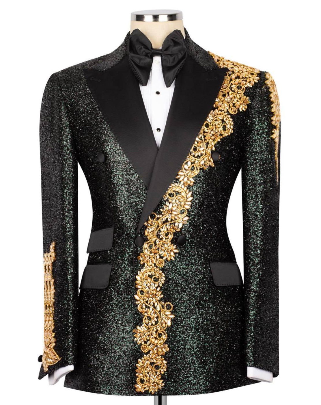 Black tuxedo with gold embroidery on a mannequin against a white background