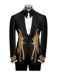 A black tuxedo jacket with ornate gold sequin and bead embroidery on the front and cuffs, displayed on a mannequin with a black bow tie and white shirt against a white background.
