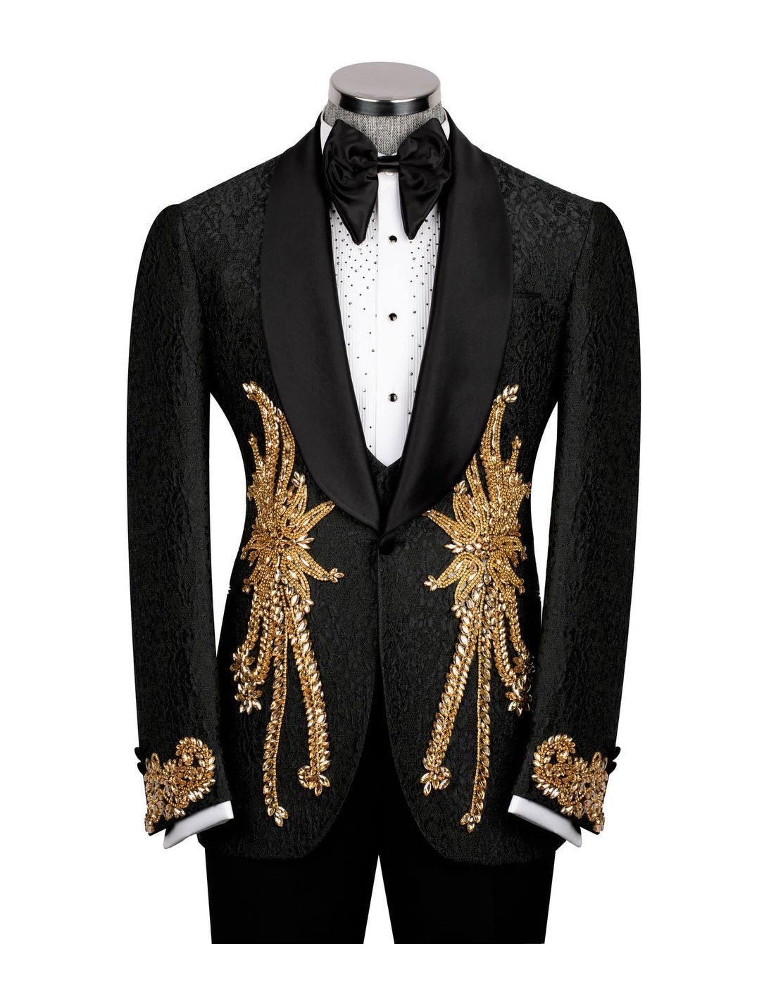 A black tuxedo jacket with ornate gold sequin and bead embroidery on the front and cuffs, displayed on a mannequin with a black bow tie and white shirt against a white background.