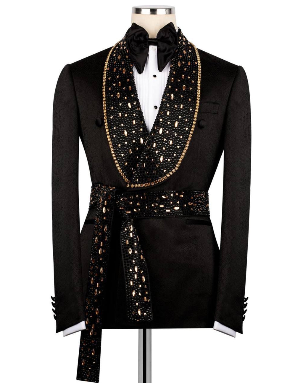 Black tuxedo with gold embellishments on a mannequin against a white background