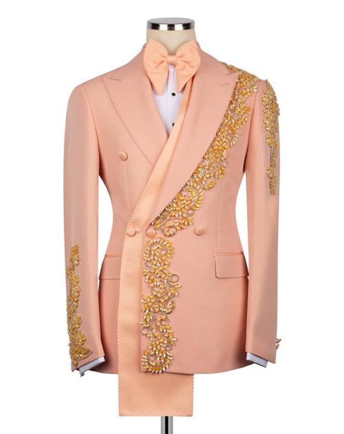 Pink suit with gold embroidery on a mannequin against a white background
