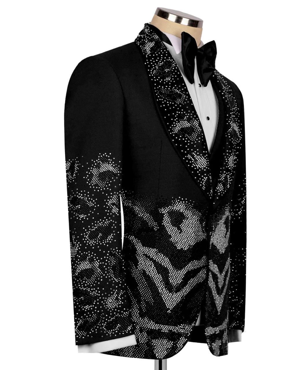 Black tuxedo jacket with decorative patterns on a mannequin against a white background