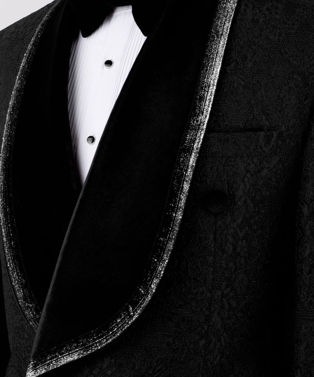 Close-up of a black tuxedo with a white shirt and bow tie.