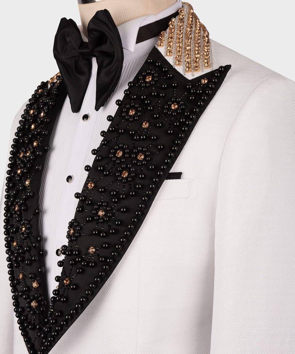 White tuxedo with black beaded lapels on a mannequin against a white background