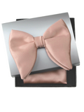 A satin pre-tied bow tie in Old Rose, displayed on top of its silver and black presentation box with a matching pocket square, on a white background with text 'BTPB51 Old Rose/Rose Gold' below.