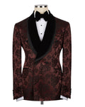 A men's tuxedo jacket with a dark brown and black floral brocade pattern, black satin shawl collar, and a black bow tie, displayed on a mannequin torso against a white background.