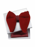 A deep red bow tie with a matching red pocket square, presented in a white gift box on a white background.