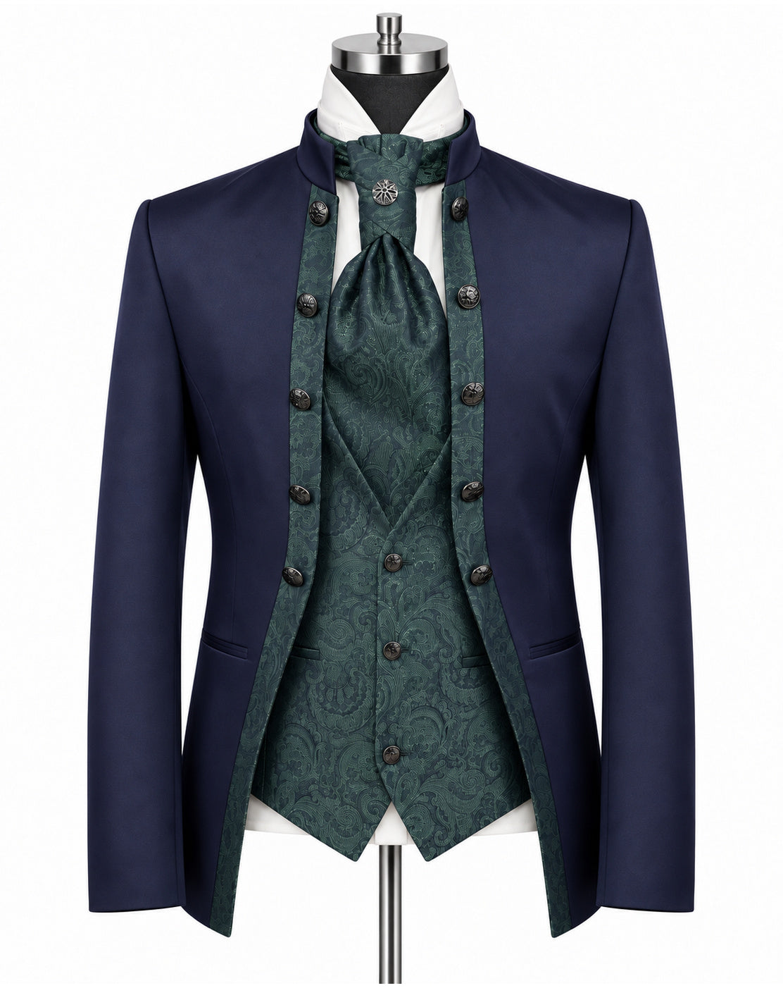 A men's formalwear outfit displayed on a mannequin against a plain white background, featuring a navy blue tailcoat jacket, a dark green patterned waistcoat, matching green patterned cravat, white shirt, and dark buttons.