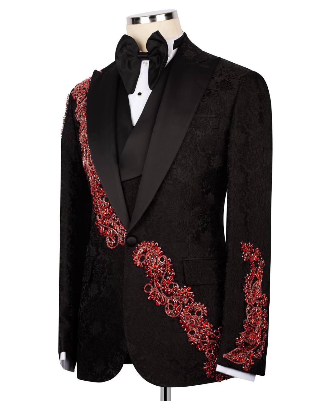 Black tuxedo with red embroidery on a mannequin against a white background
